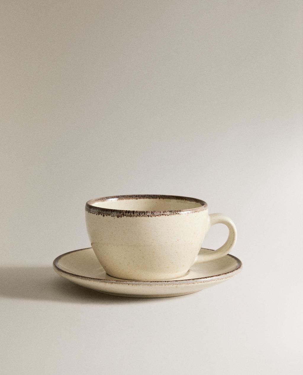 STONEWARE TEACUP AND SAUCER