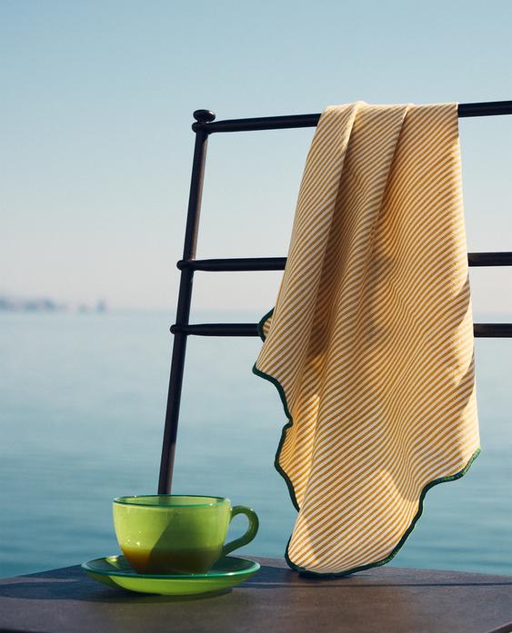 COFFEE CUP, LOOSE CHAIR, AND NAPKIN