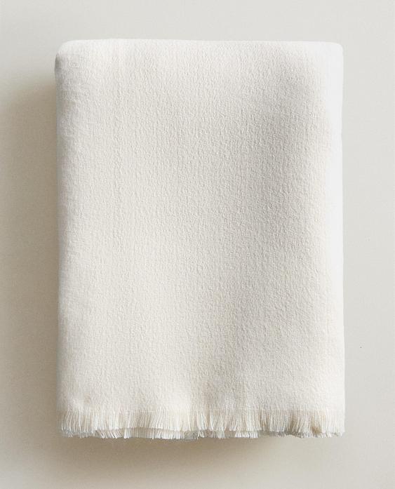 FRINGED DECORATIVE THROW