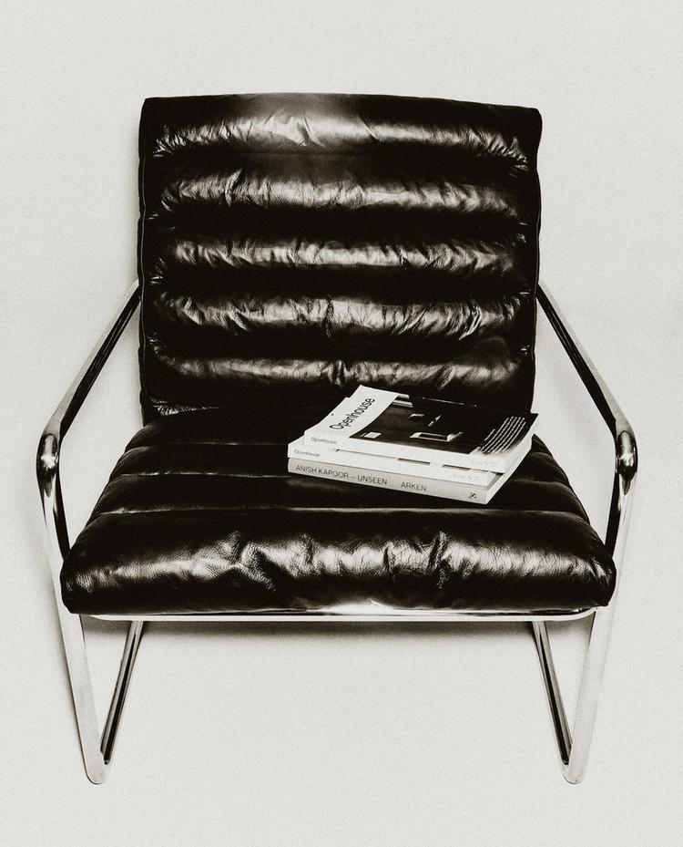 LEATHER AND STAINLESS STEEL ACCENT CHAIR
