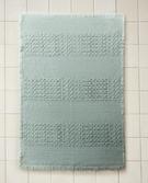 BATH MAT WITH FRAYED EDGES