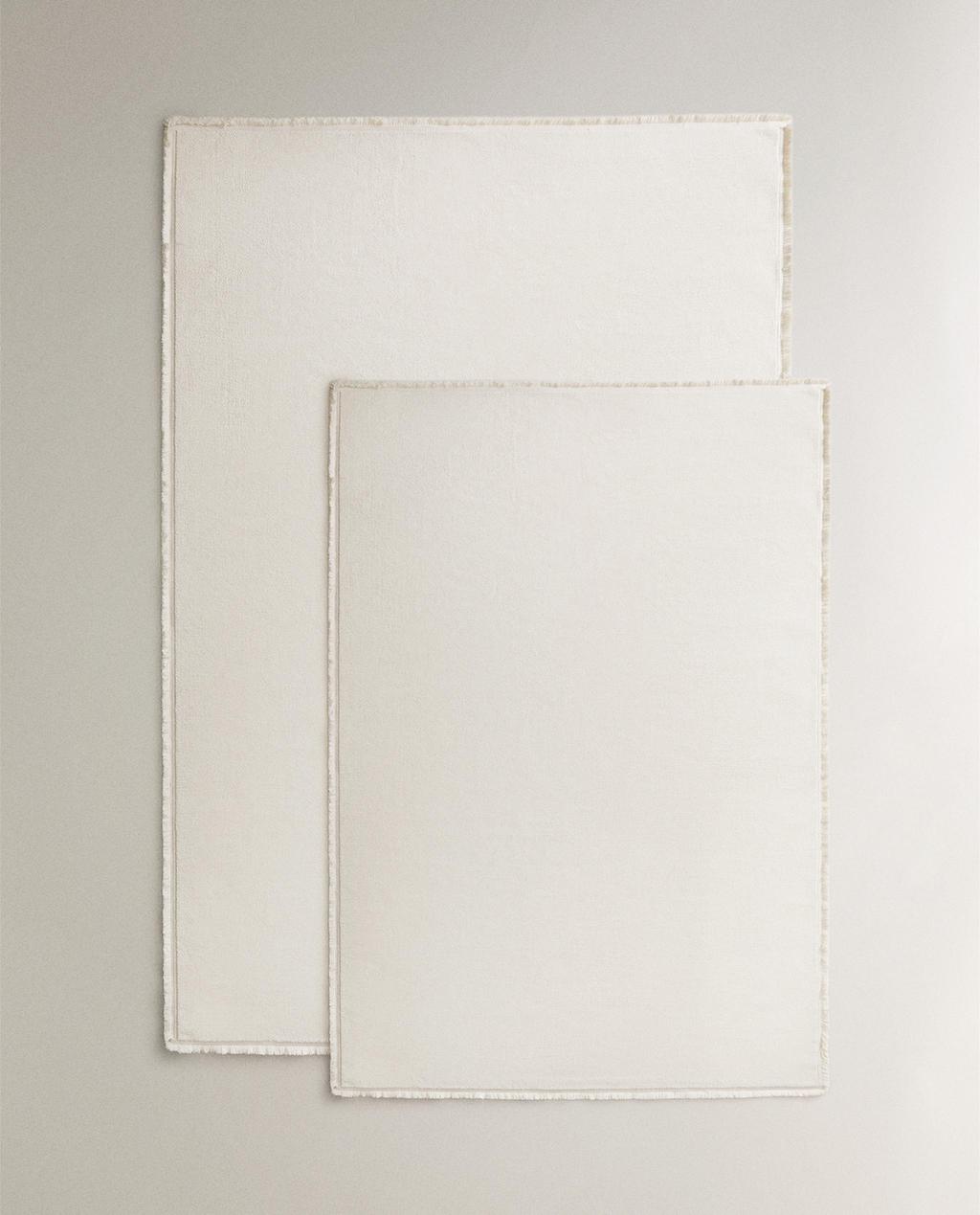 FRINGED RUG