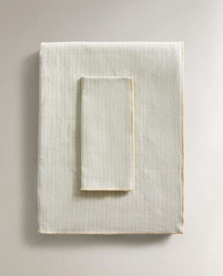 TOALHA DE MESA LISTRADA COM OVERLOCK