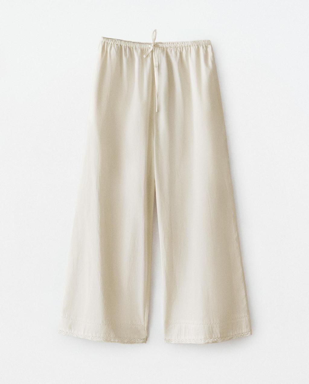 CALÇA COM PREGAS
