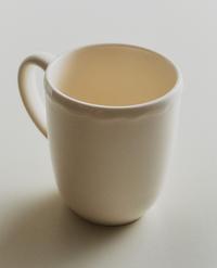 EARTHENWARE MUG WITH RAISED-DESIGN EDGE