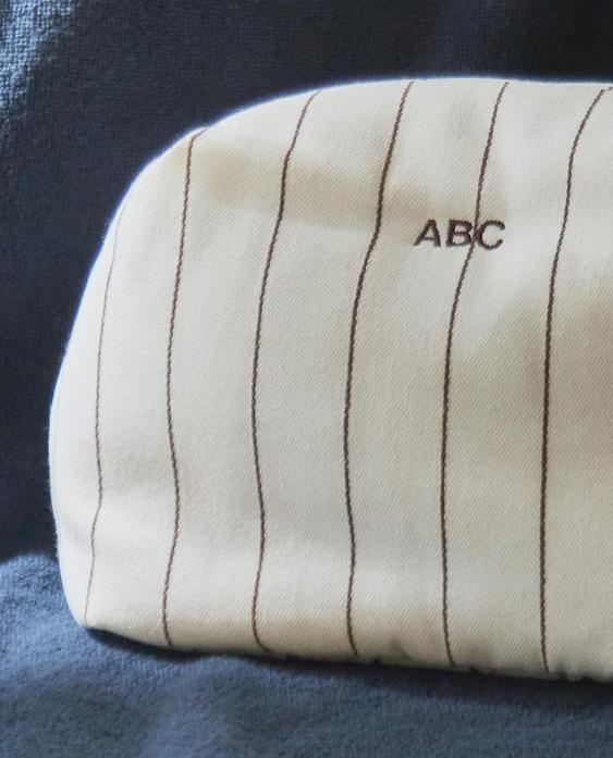 STRIPED TOILETRY BAG