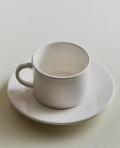 STONEWARE TEACUP AND SAUCER