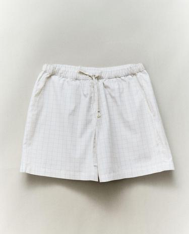 PANTALONI SCURȚI ÎN CAROURI