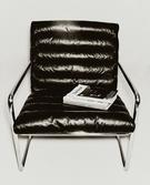 LEATHER AND STAINLESS STEEL ACCENT CHAIR