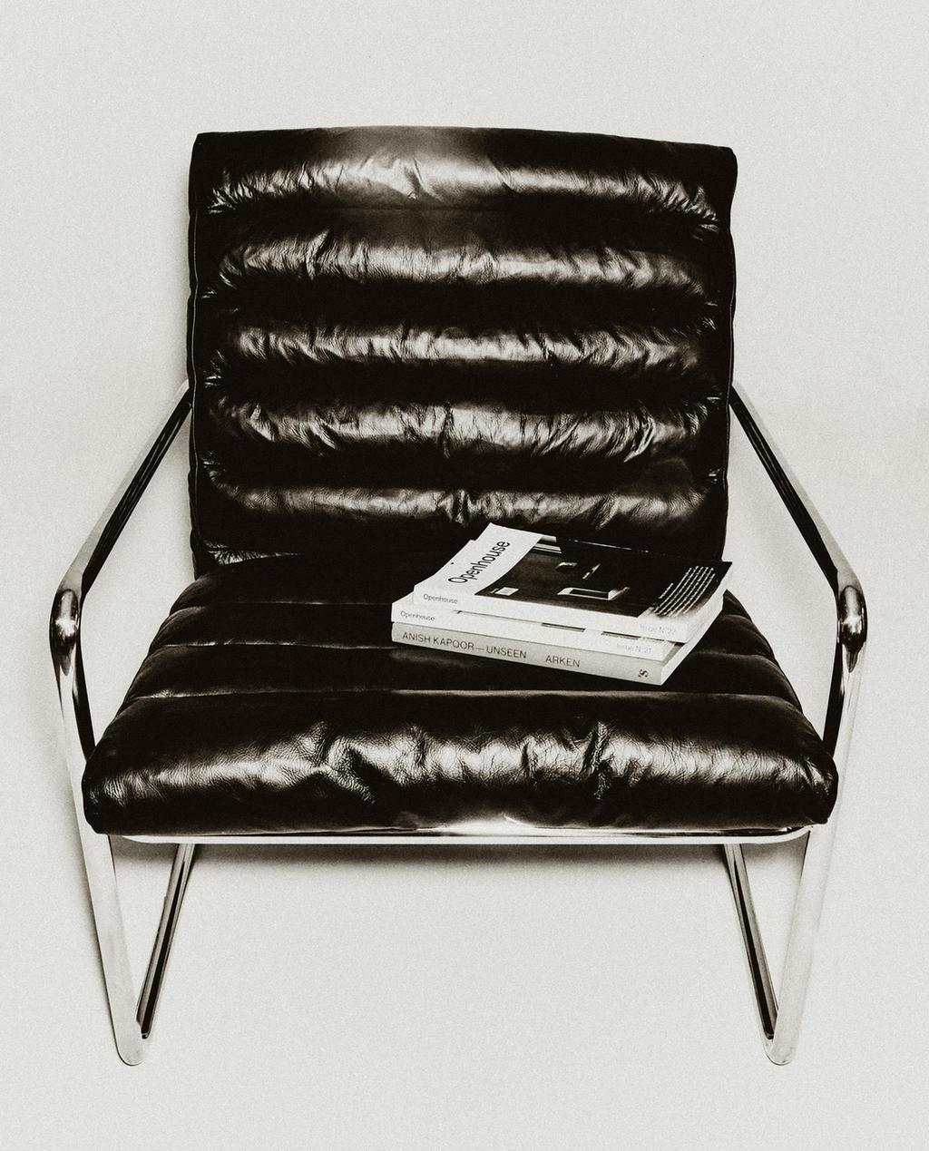 LEATHER AND STAINLESS STEEL ACCENT CHAIR