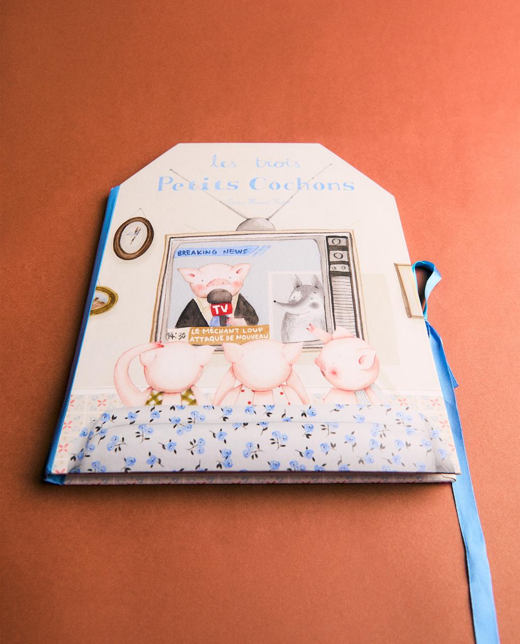 KARUSSELLBUCH DIE DREI KLEINEN SCHWEINCHEN (FRANZÖSISCH)