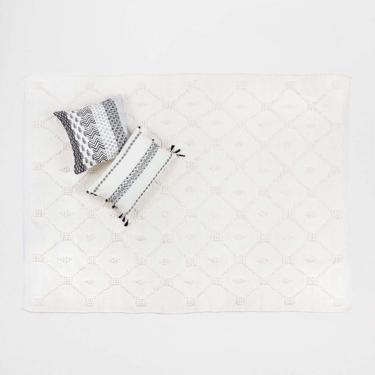 Afbeelding 1 van het product Ecru katoenen tapijt met argylemotief