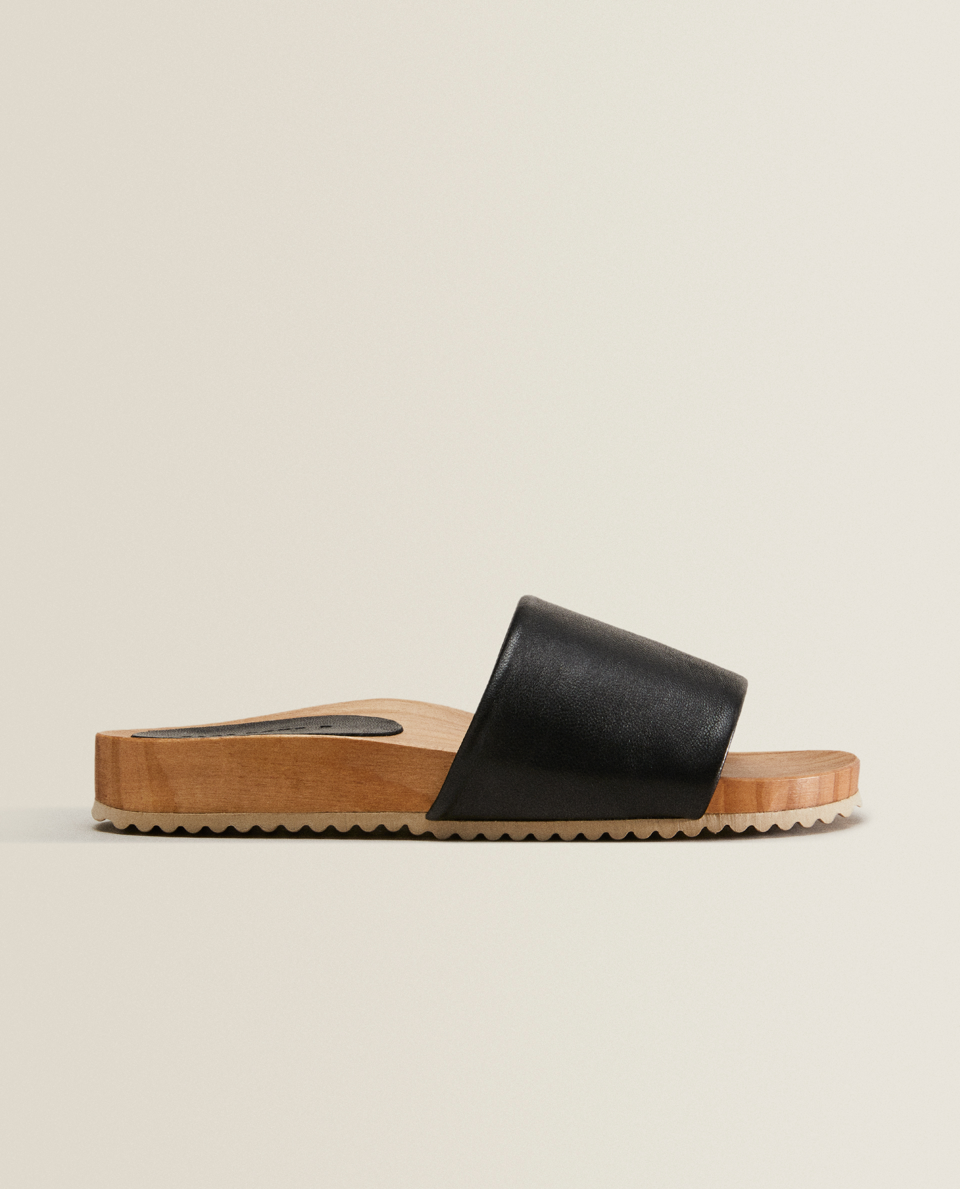 black wooden sandals