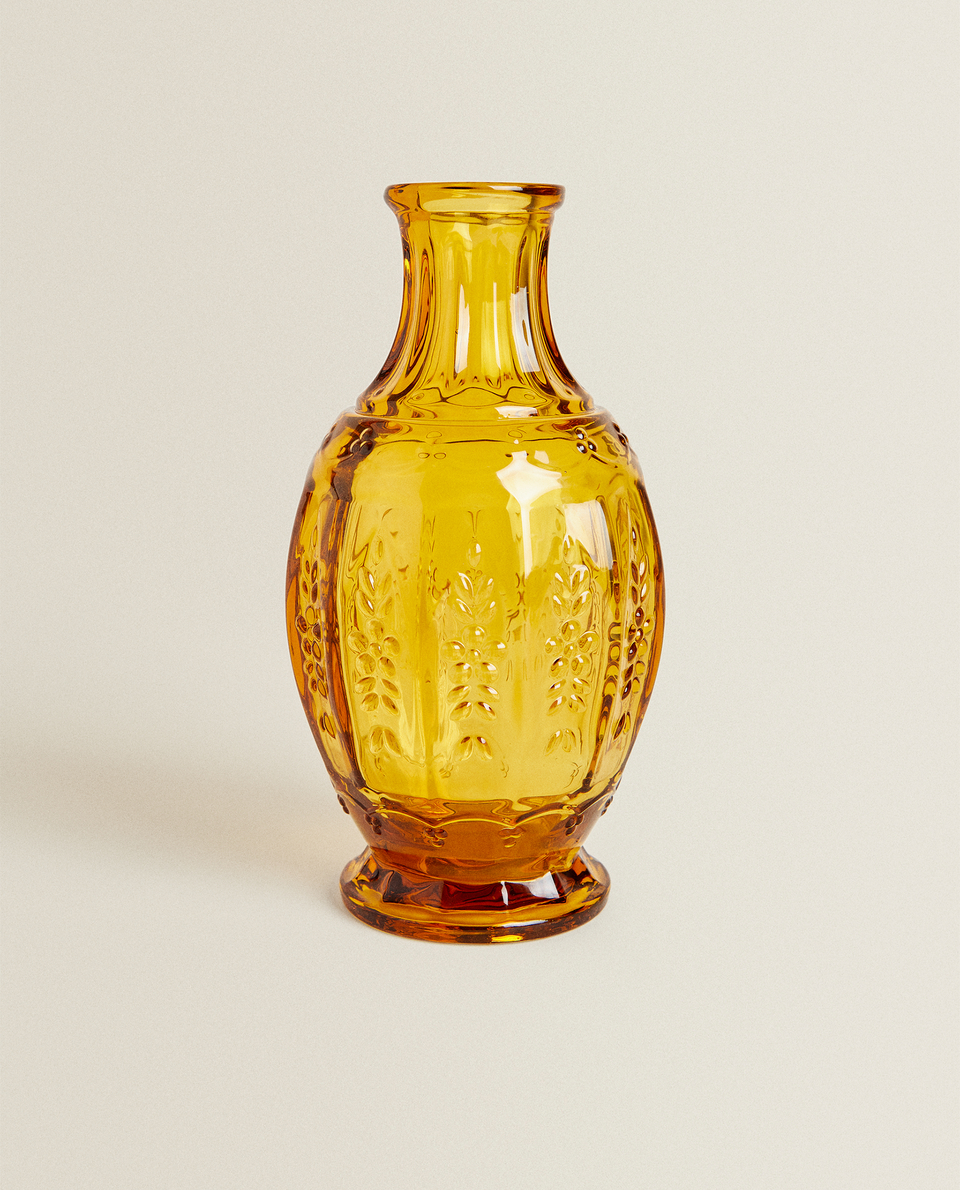 GLASS BOTTLE WITH FLORAL RELIEF