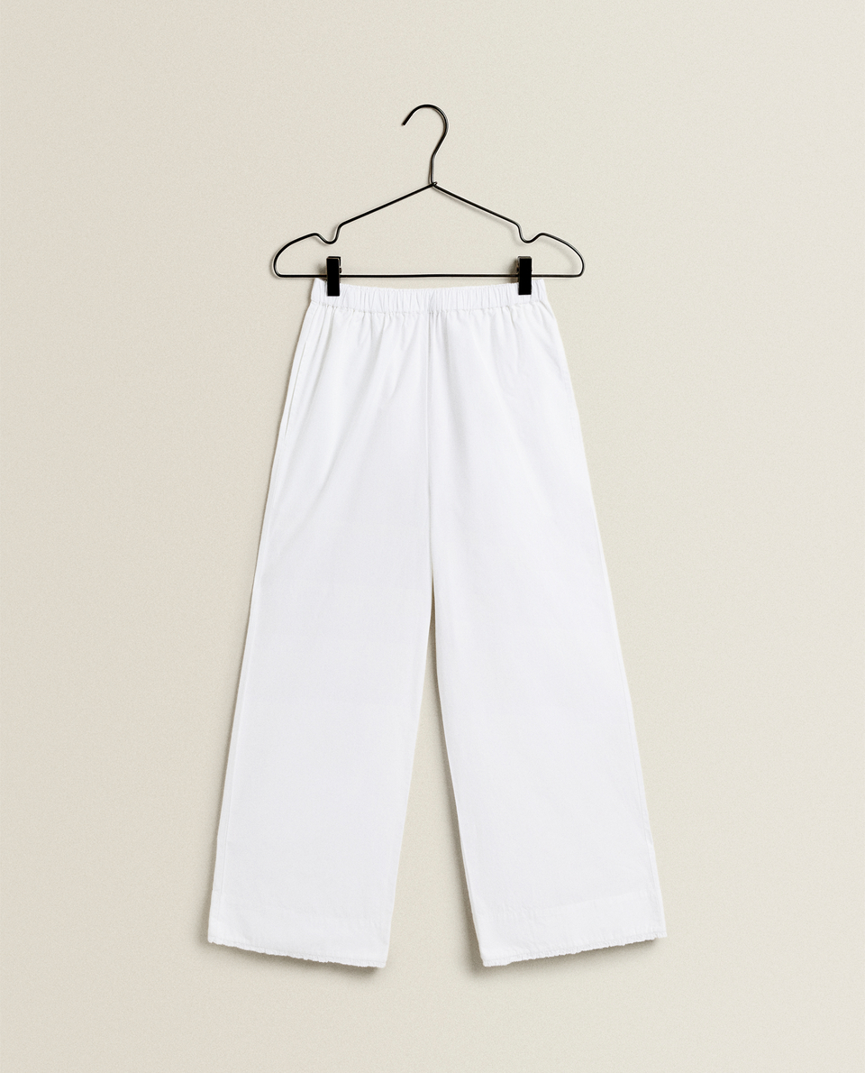 COTTON TROUSERS WITH RUFFLE TRIM