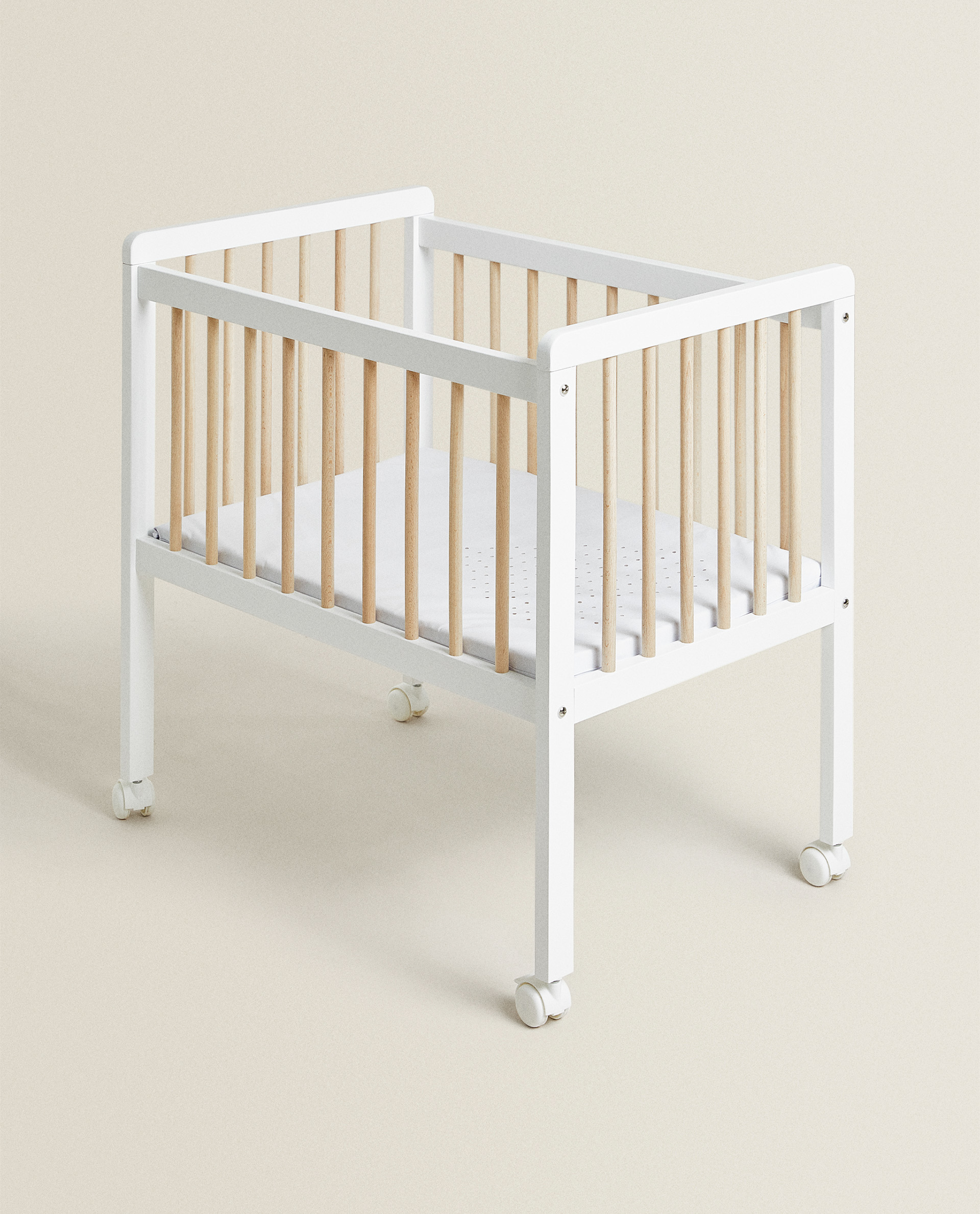 small white cot