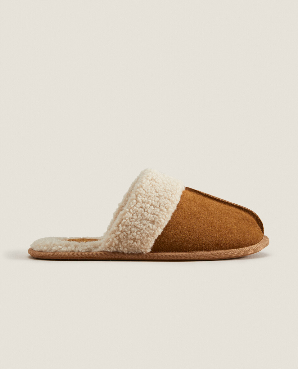 Leather slippers with faux shearling inners