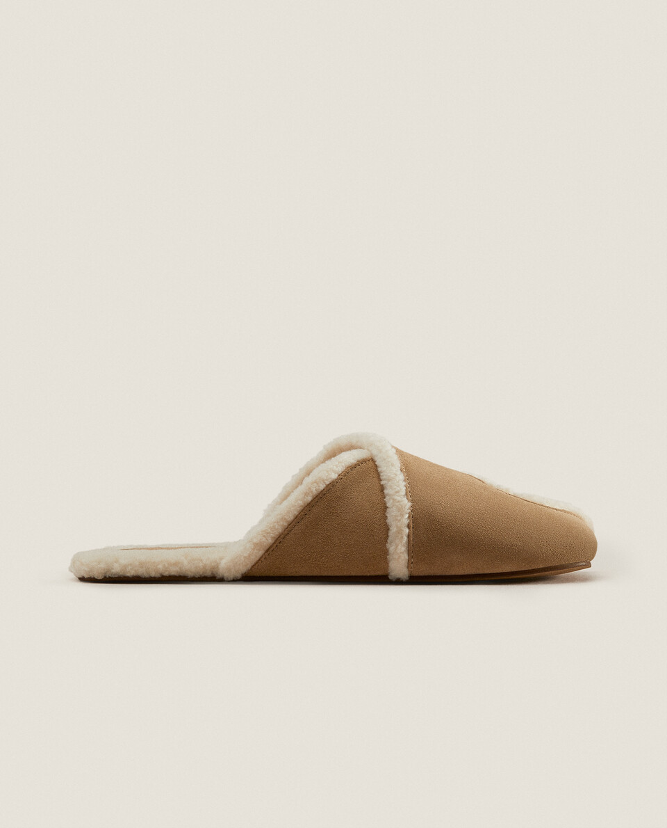 Leather slippers with faux shearling