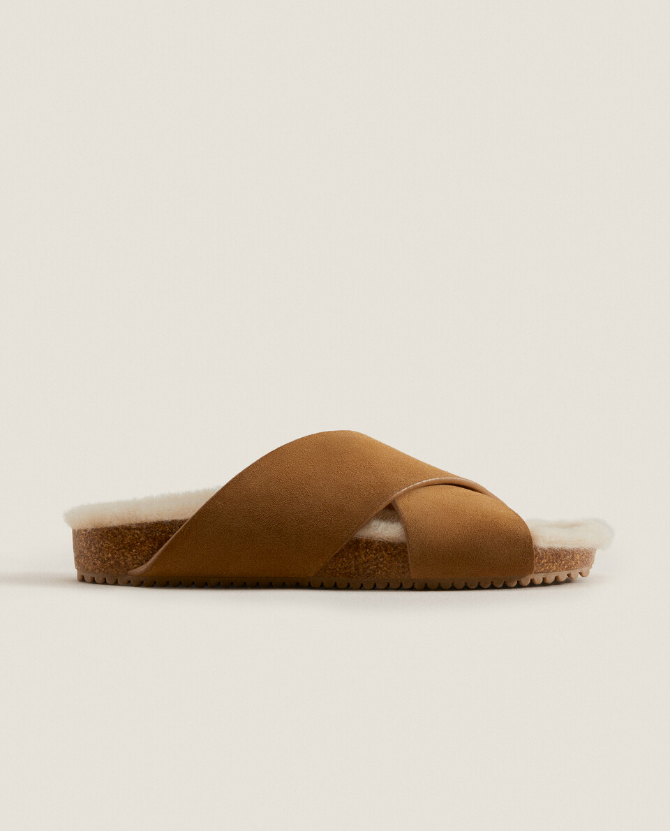 Leather crossover sandal style slippers with faux fur lining