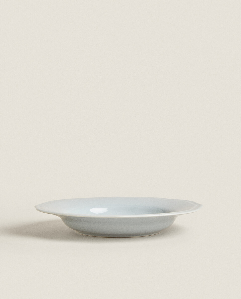 BLUE SOUP PLATE WITH RAISED-DESIGN EDGE