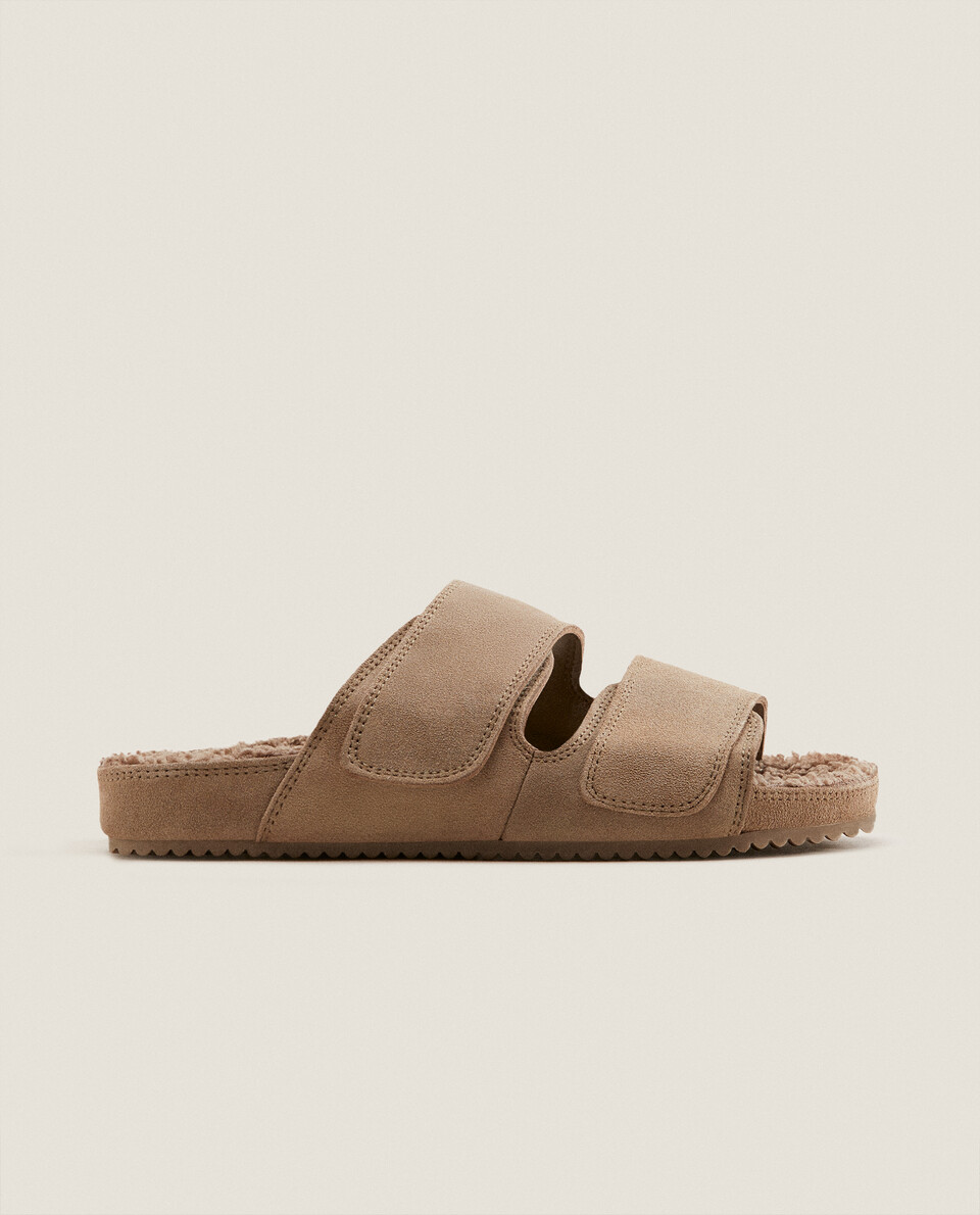 Leather sandals with two straps and faux shearling detail