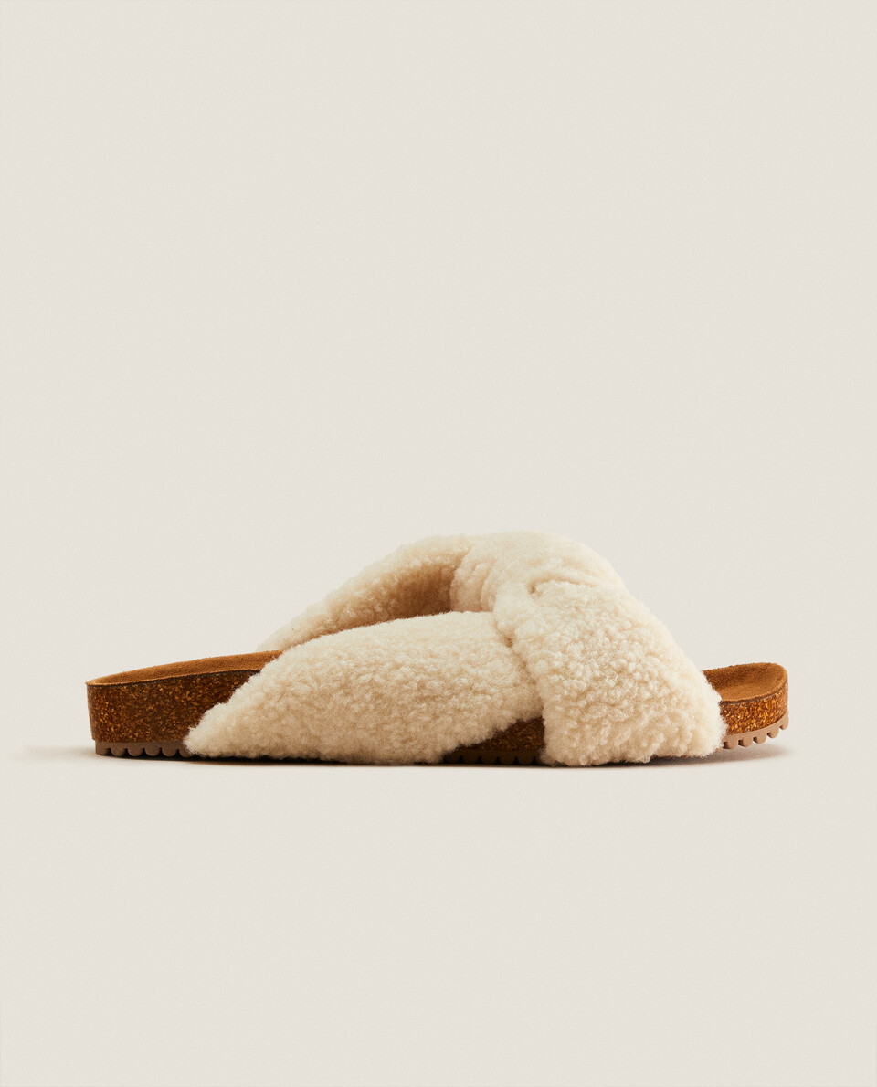 Knotted faux shearling sandals
