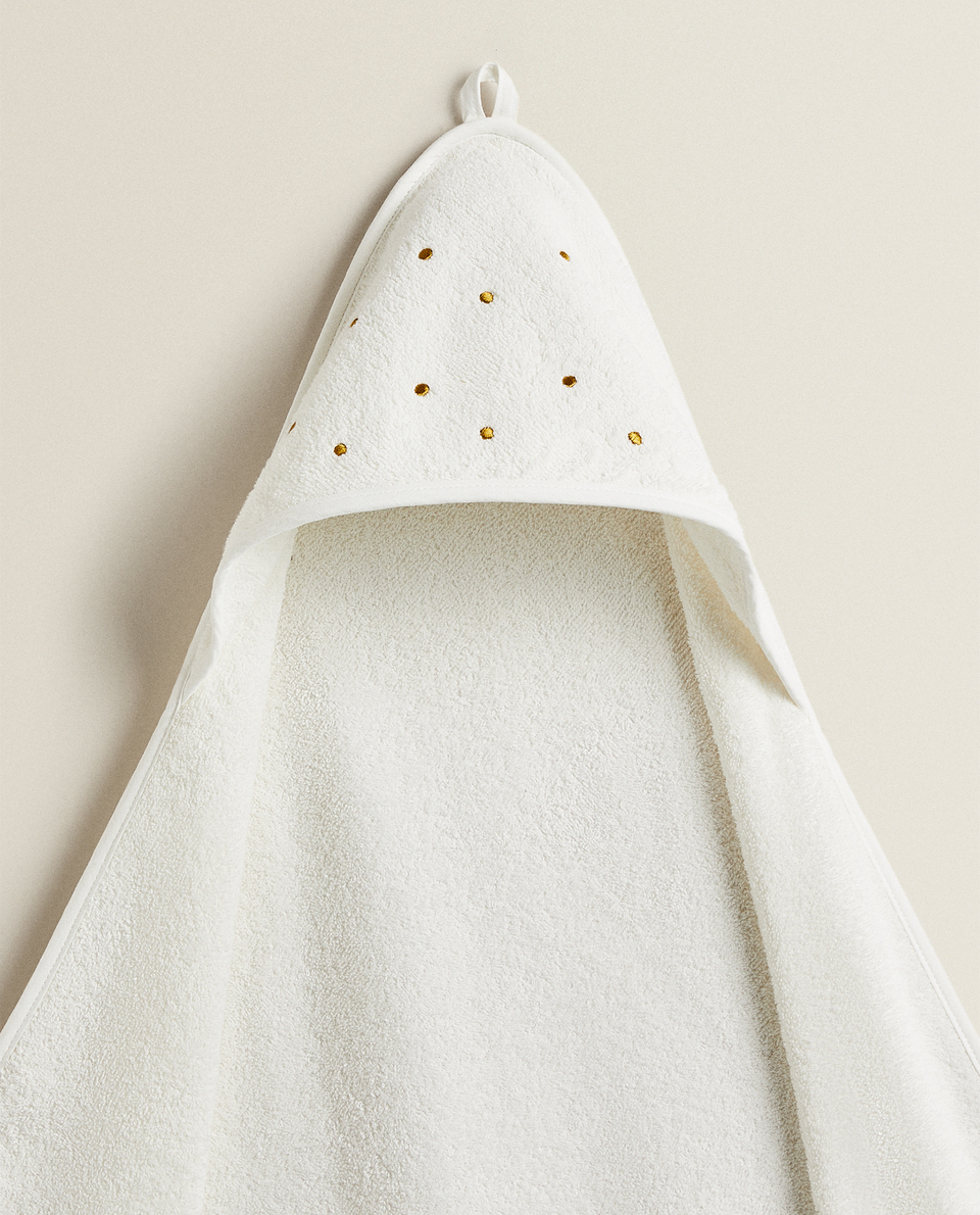 EMBROIDERED POLKA DOT AND TASSEL HOODED TOWEL
