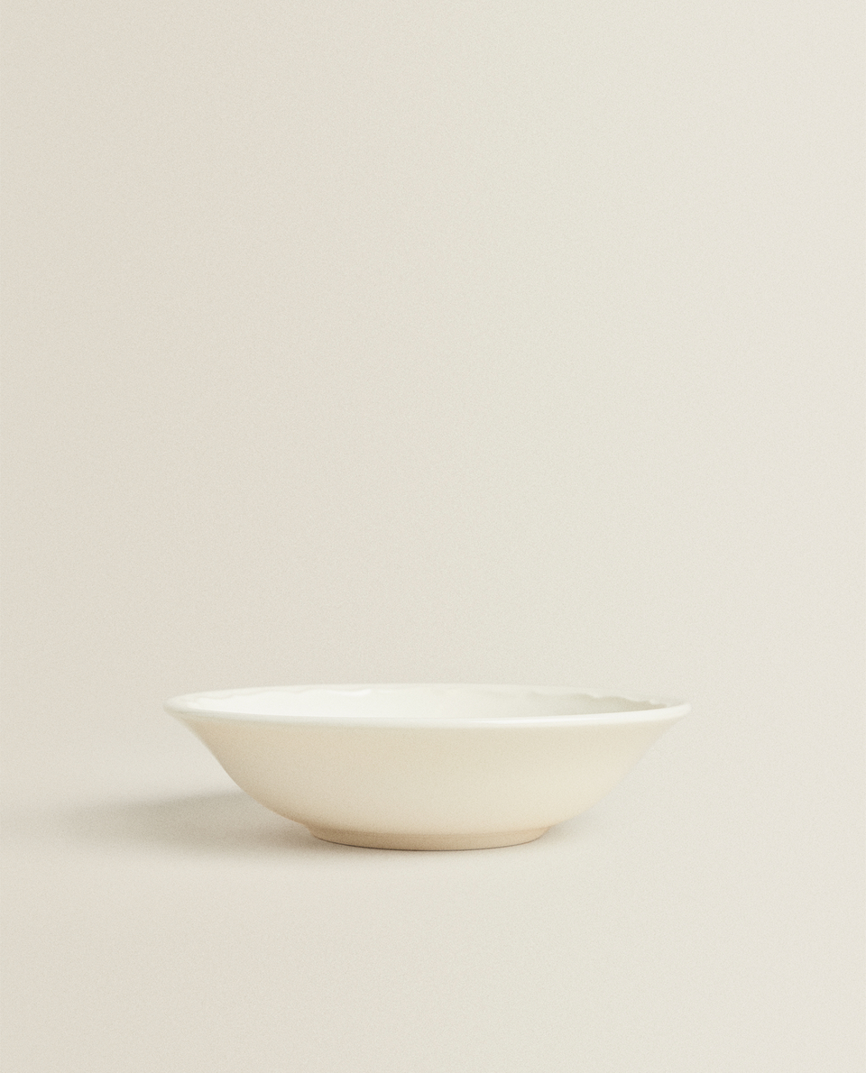 EARTHENWARE BOWL WITH A RAISED-DESIGN EDGE