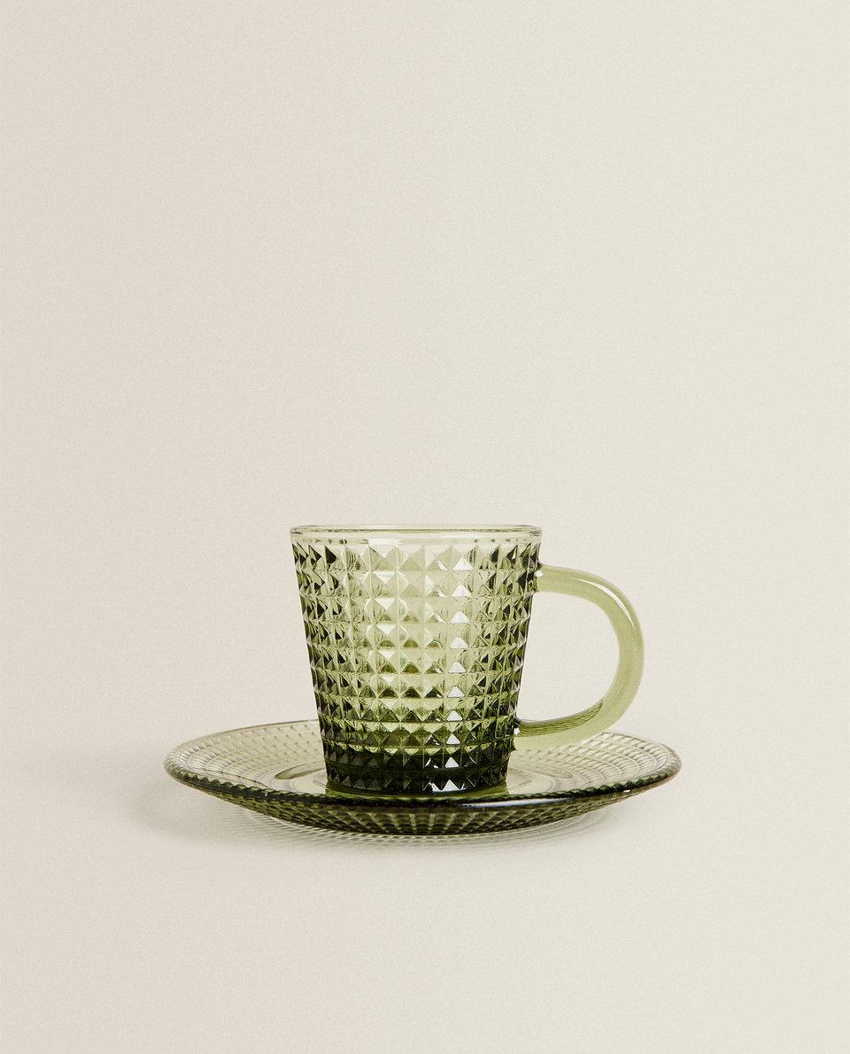 RAISED-DESIGN TEACUP AND SAUCER