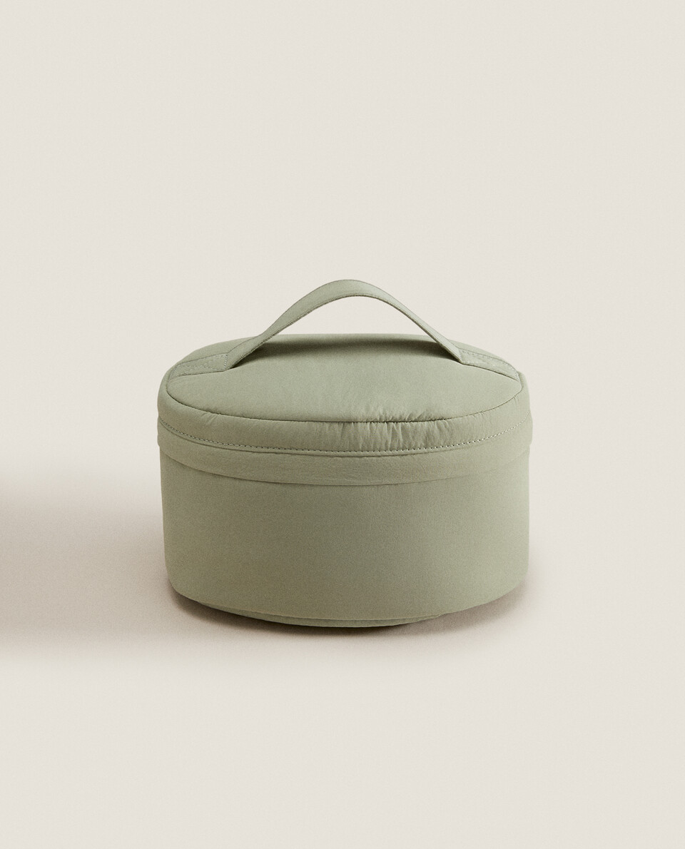 Oval technical fabric cosmetic bag