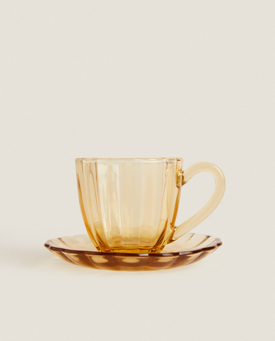 COFFEE CUP AND SAUCER WITH RAISED DESIGN