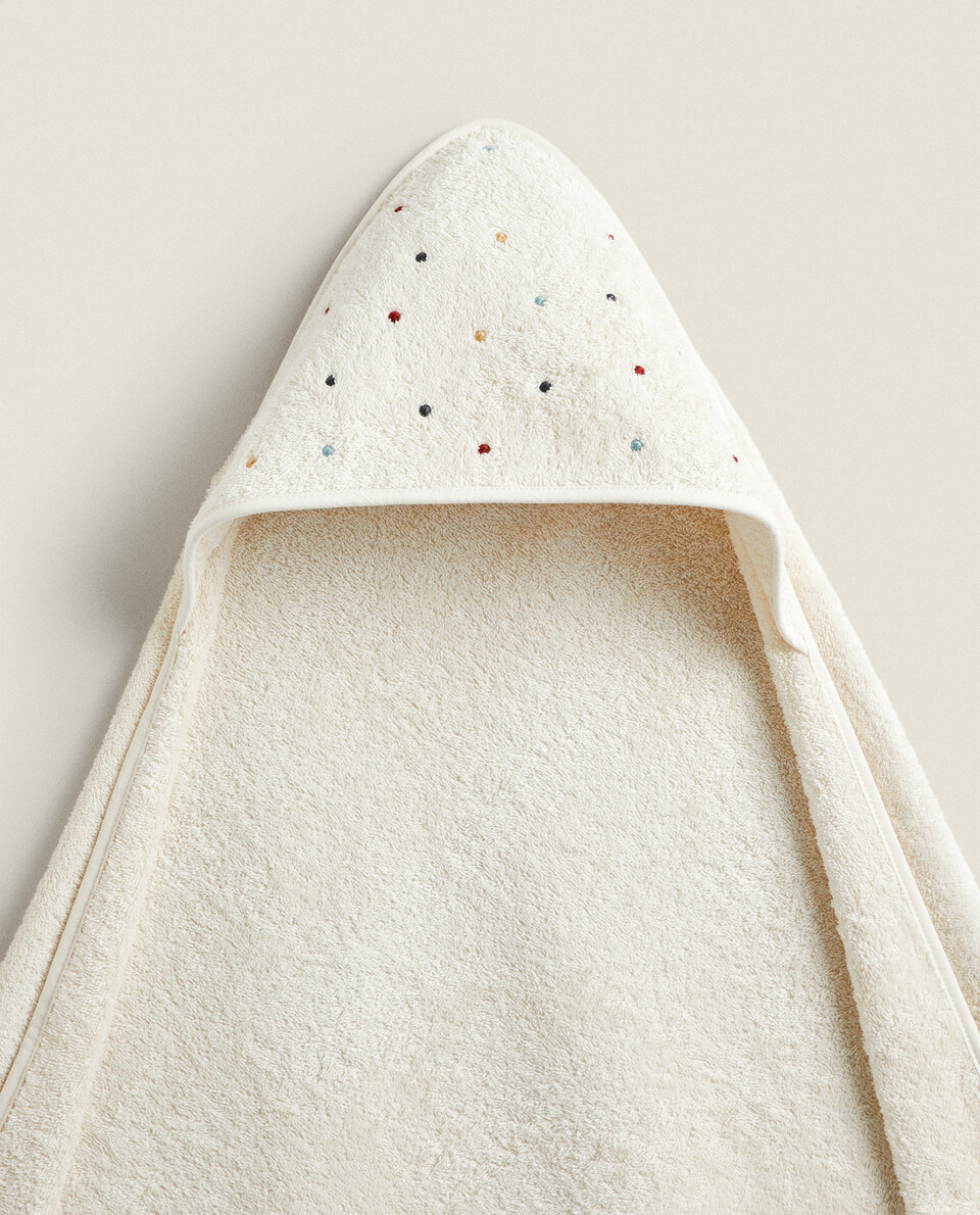 BABY CAPE WITH EMBROIDERED POLKA DOTS