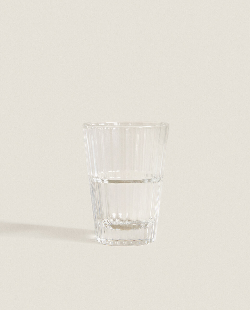 FACETED GLASS SHOT GLASS.