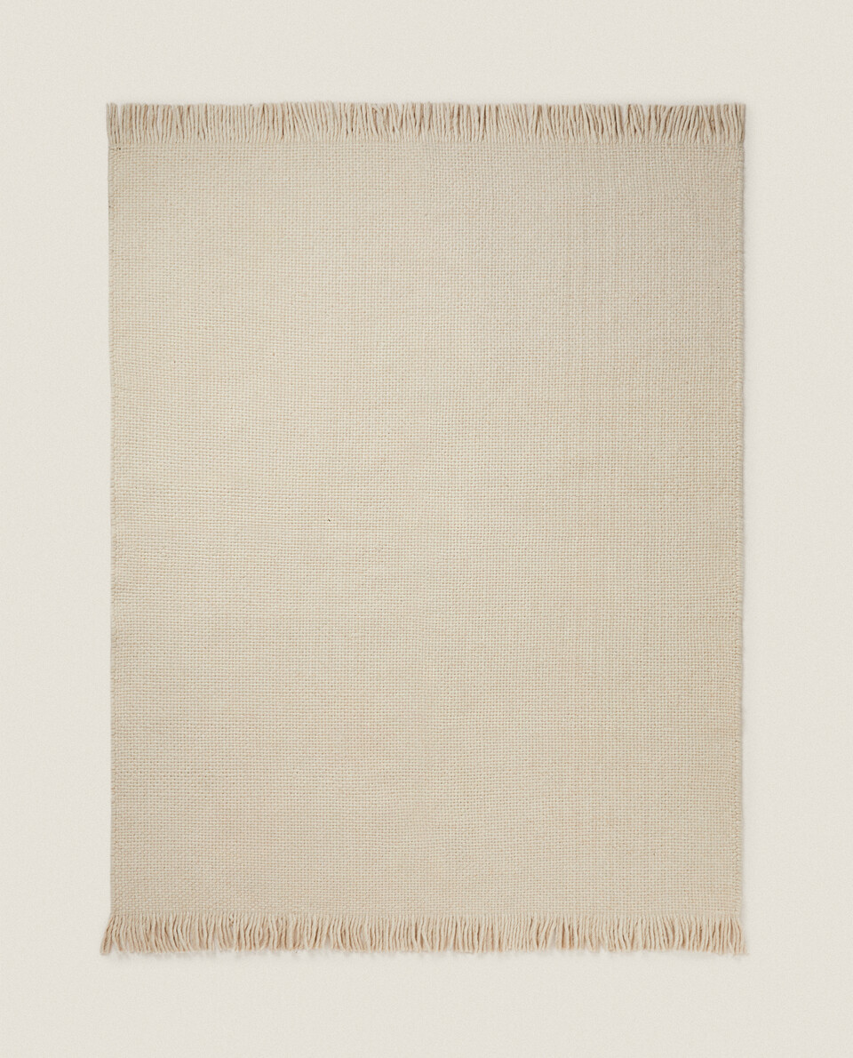 WOOL RUG WITH FRINGING