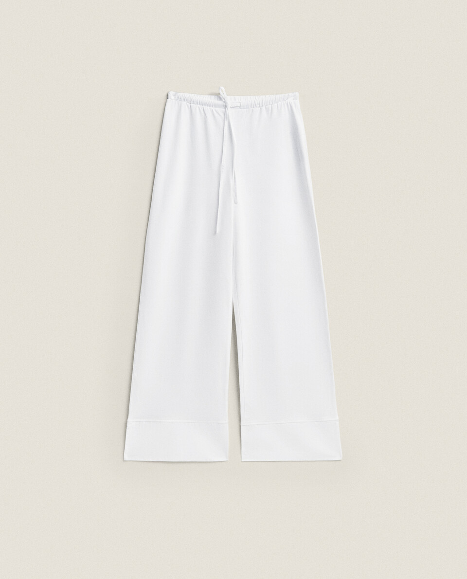 White cotton store trousers