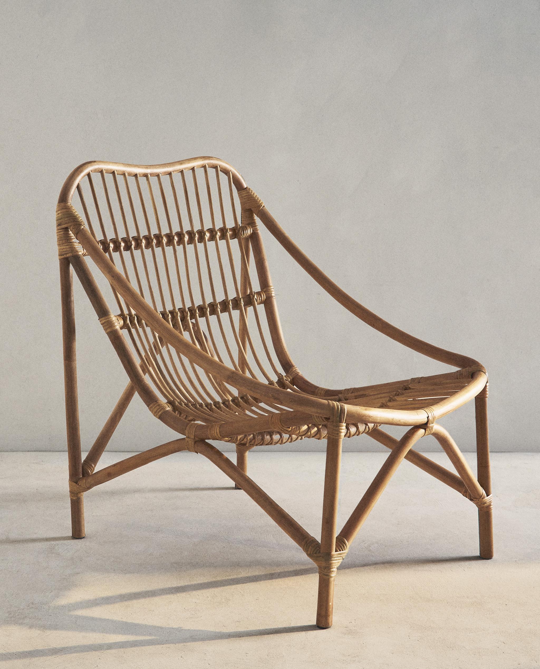 RATTAN ACCENT CHAIR AND STRIPED CUSHION