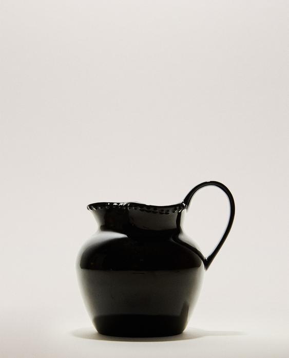 STONEWARE JUG WITH RAISED DESIGN STONEWARE JUG WITH RAISED DESIGN