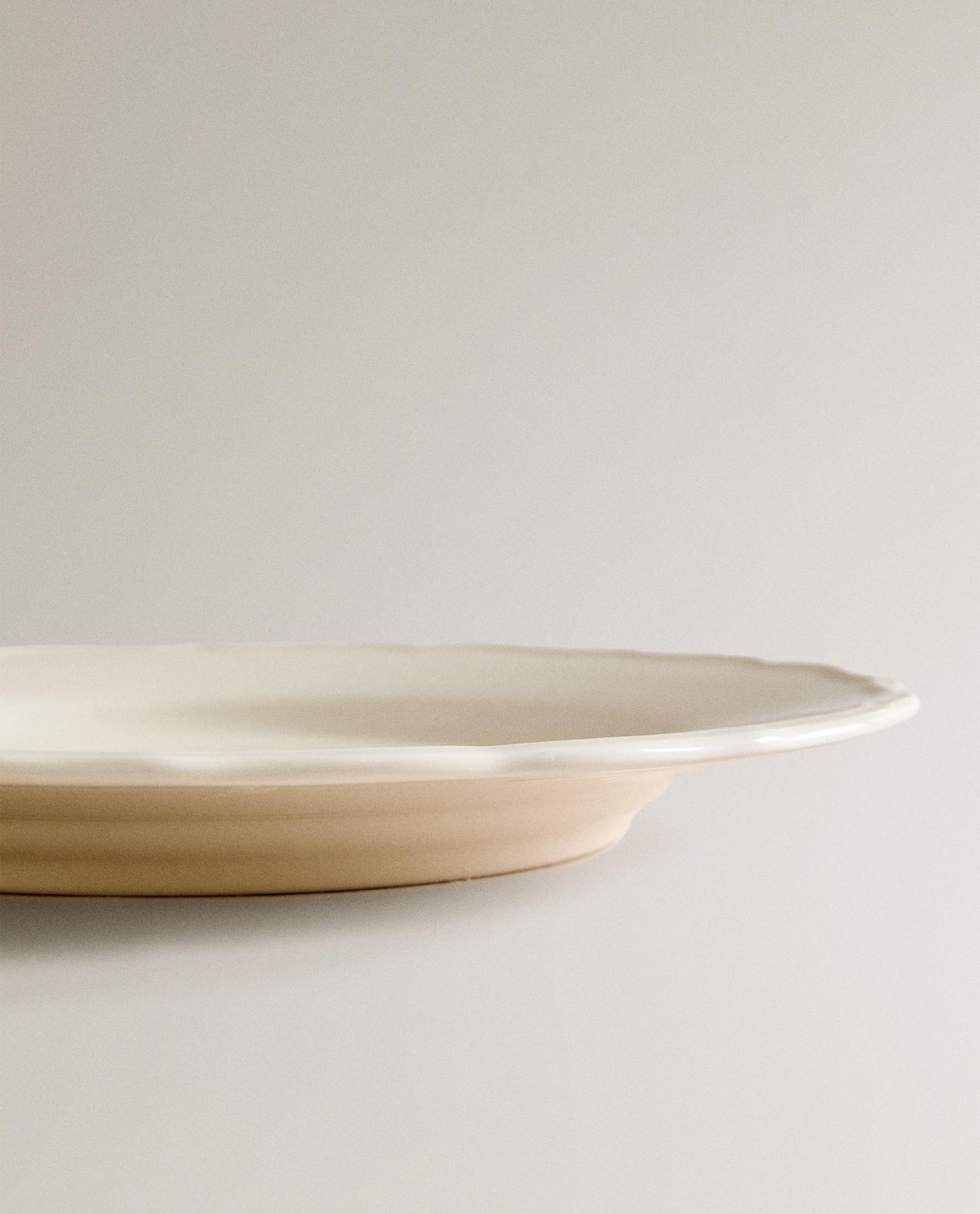 EARTHENWARE DINNER DISH WITH RAISED-DESIGN EDGE