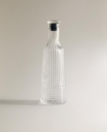 GLASS BOTTLE WITH RELIEF DESIGN