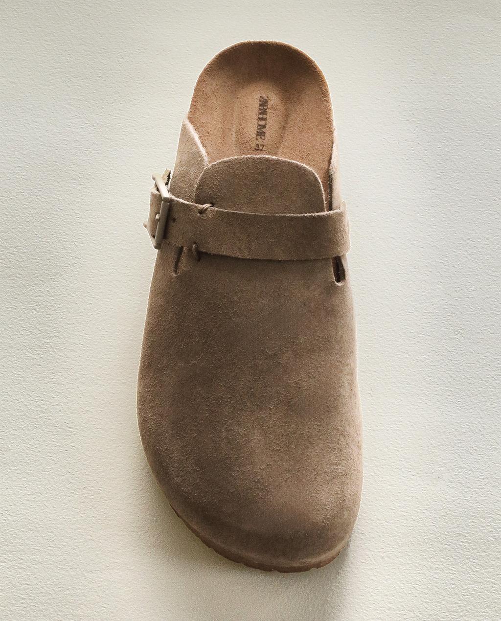 קבקבי עור עם אבזם ותפירה גלויה