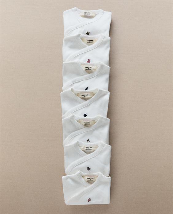 SET OF EMBROIDERED COTTON BODYSUITS (PACK OF 7)