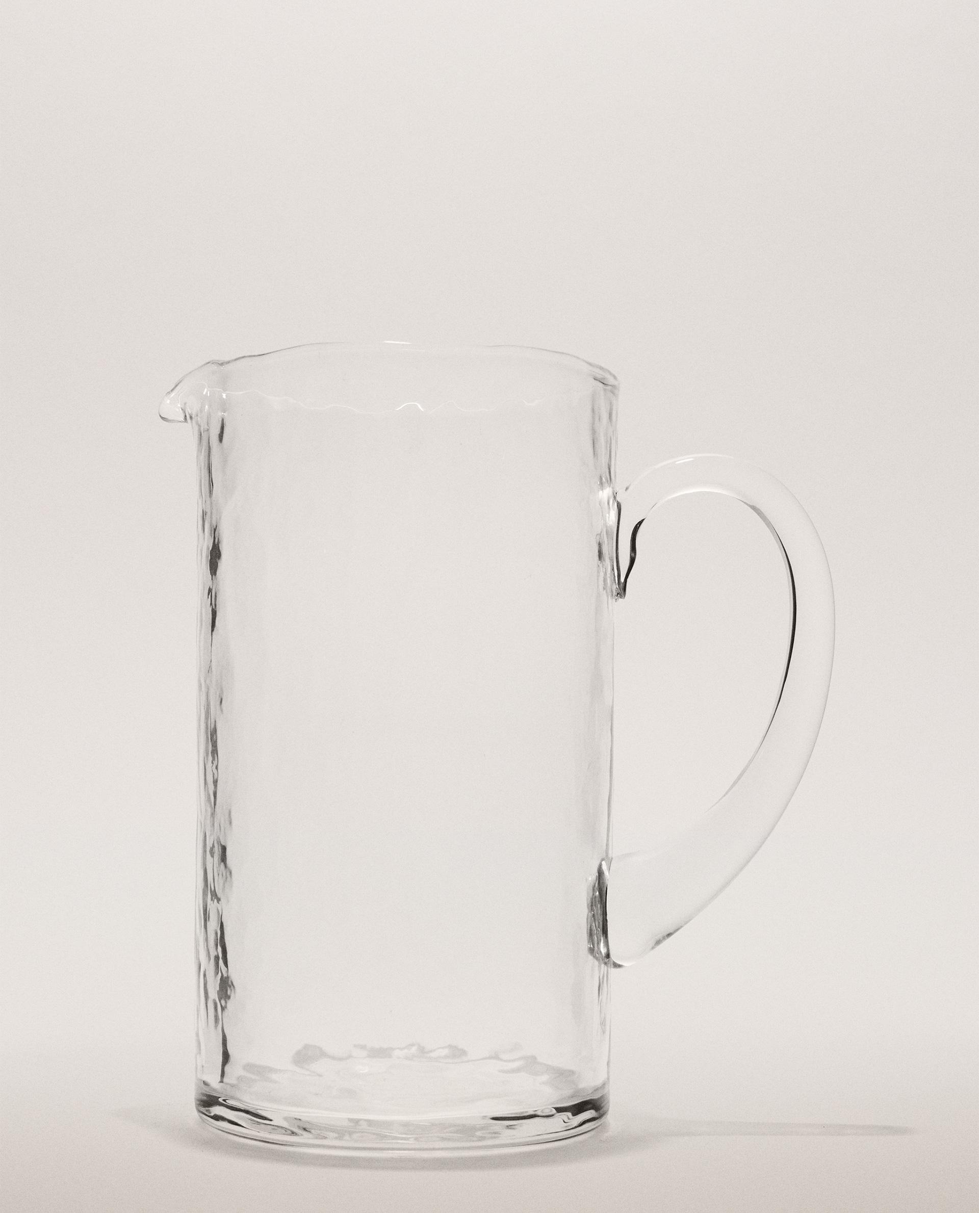 KRUG AUS GEHÄMMERTEM GLAS KRUG AUS GEHÄMMERTEM GLAS