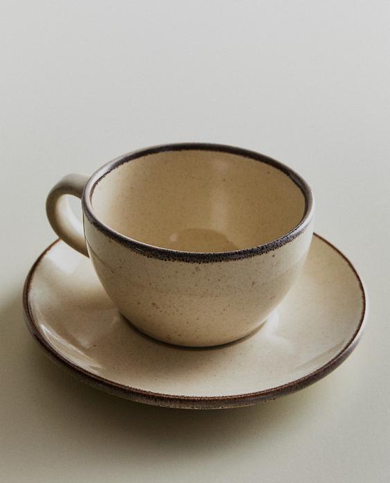 STONEWARE TEACUP AND SAUCER