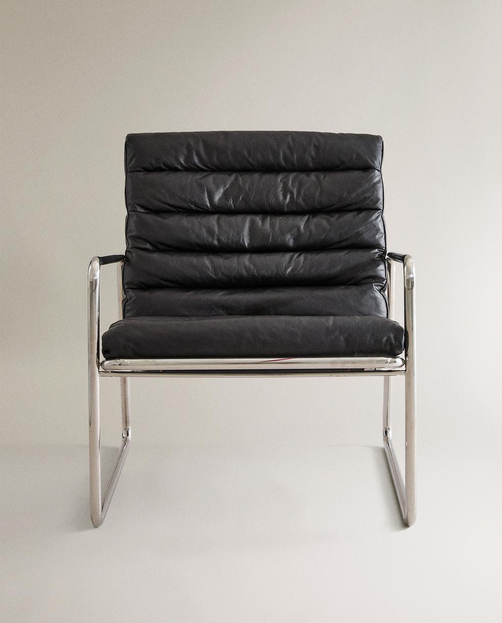 LEATHER AND STAINLESS STEEL ACCENT CHAIR LEATHER AND STAINLESS STEEL ACCENT CHAIR