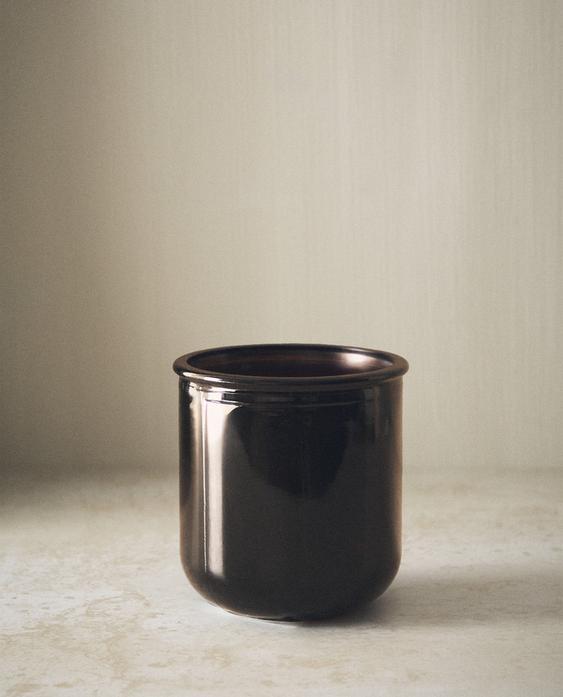 حامل فرش أسنان من الزجاج الداكن