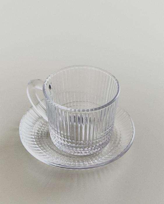 GLASS COFFEE CUP AND SAUCER WITH RAISED GEOMETRIC DESIGN