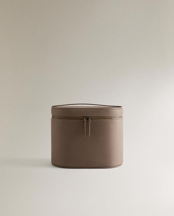 TROUSSE DE TOILETTE EN CUIR OVALE