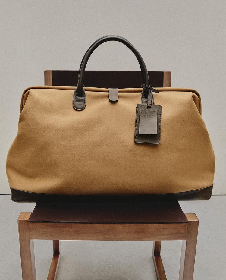 COTTON TRAVEL BAG WITH BUTTON CLOSURE