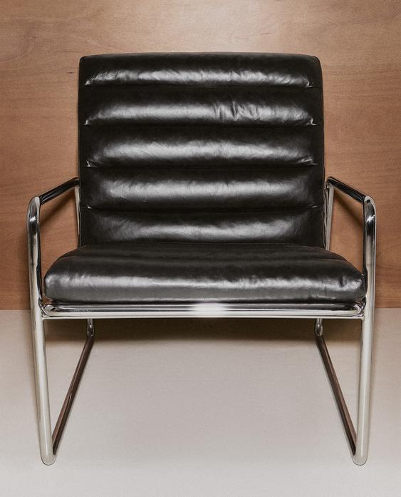 LEATHER AND STAINLESS STEEL ACCENT CHAIR