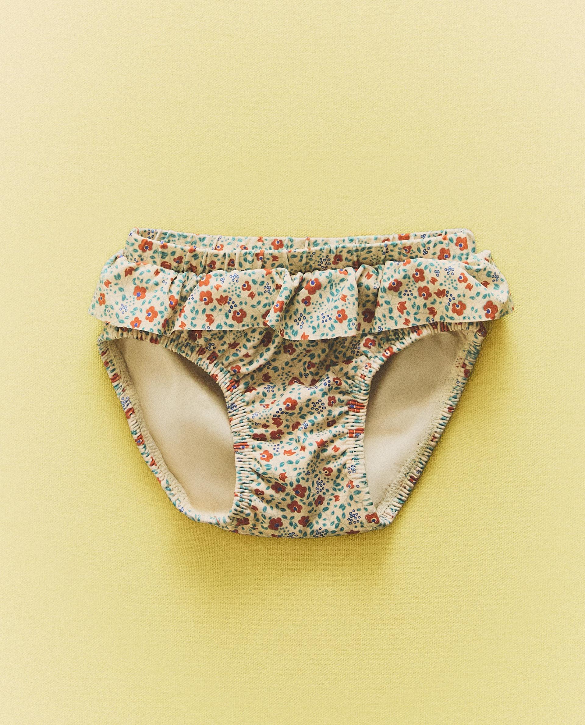 CULOTTE DE PLAGE BÉBÉ À VOLANT FLEURS CULOTTE DE PLAGE BÉBÉ À VOLANT FLEURS